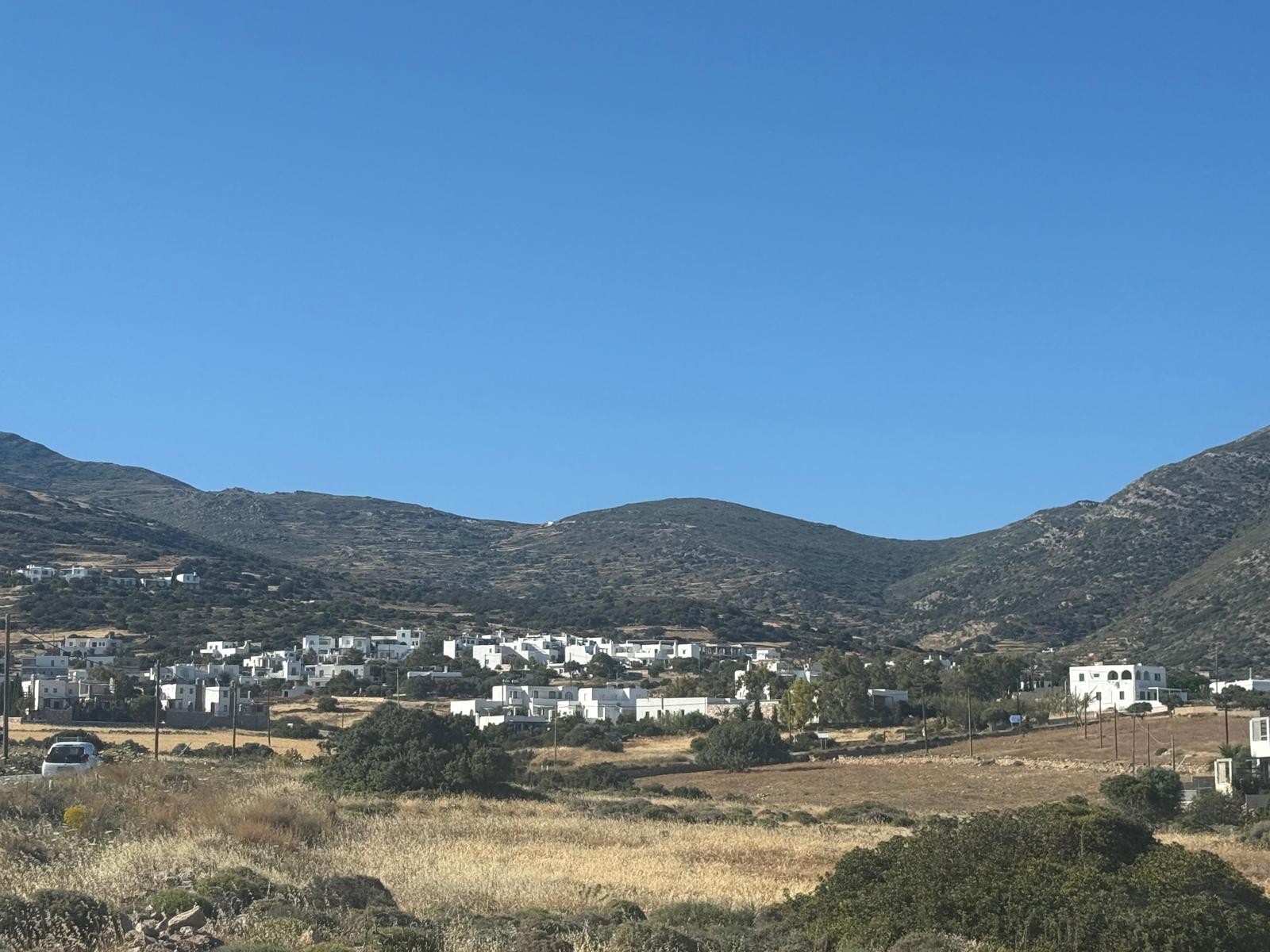 Aspro Chorio village — the quiet hillside setting of the suites