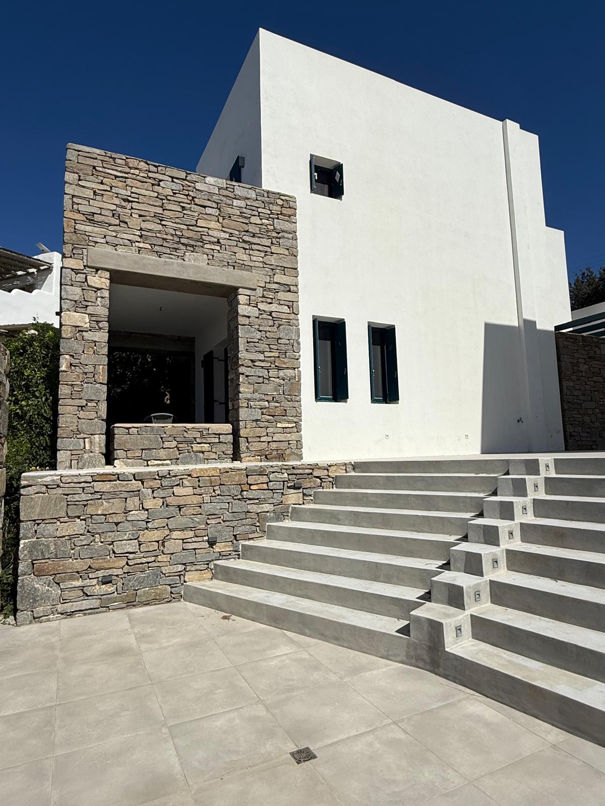 The Garden Suite — courtyard with lemon trees and shared infinity pool